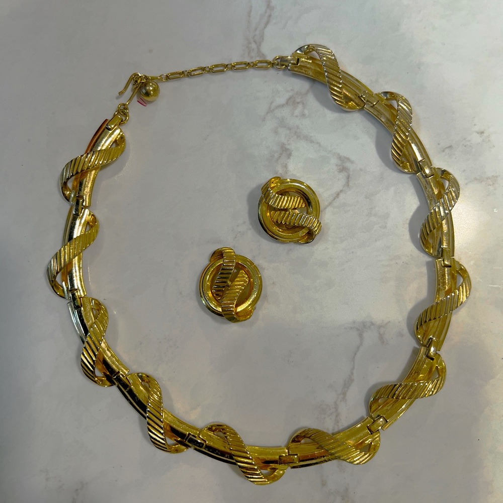 Trifari gold toned necklace and matching earrings